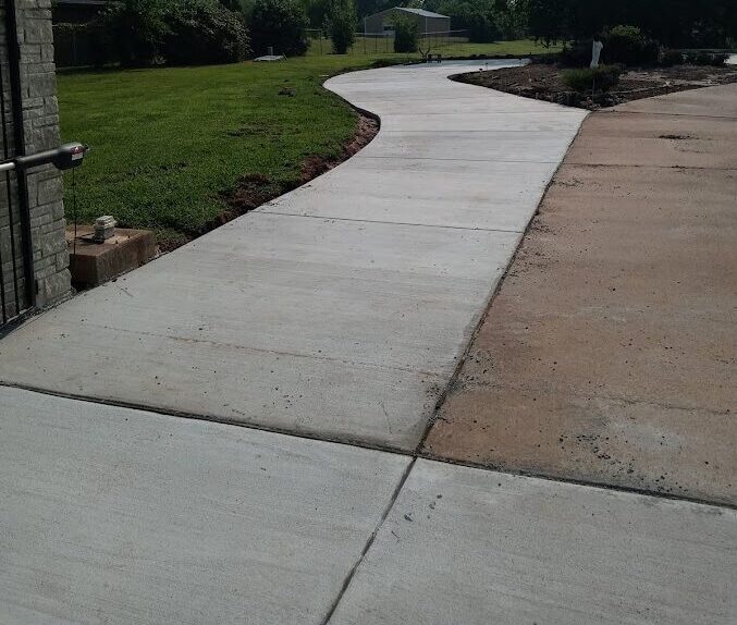 Residential driveway extension with concrete paving